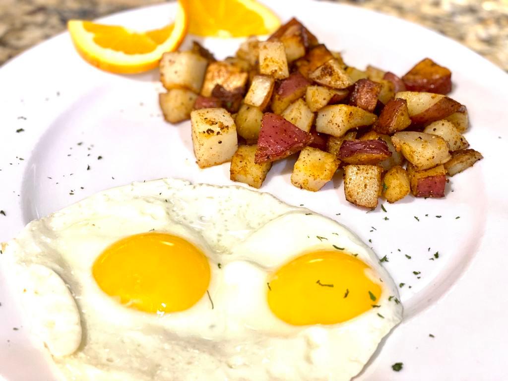 Ovo Eggs · Two eggs any style you like. Served with desiree potato hash and your choice of toast.