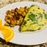 Matamoros Omelet · Goat cheese, spinach, and marinated portobellos. Served with desiree potato hash and your ch...