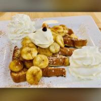 Banana Cinnamon French Toast · Brioche French toast topped with caramelized bananas, mascarpone cheese powdered sugar and w...