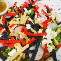 Fall Harvest Salad · Mix greens, radishes, tomato, fried tortilla strips, red onions, goat cheese, avocado, with ...