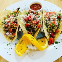 Ovo Breakfast Tacos · eggs scrambled with chorizo, sprinkled cotija cheese, topped with pico de gallo and sided wi...
