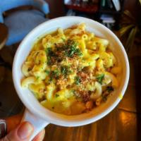 Mac & Cheese · Creamy macaroni and cheese topped with bread crumbs. 