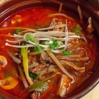 Spicy Beef Stew Noodle · Hearty soup packed with healthy hunks of pulled beef chuck, fernbrake, taro stems, onions, e...