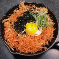 Kimchi Beef Fried Rice · Stir-fried rice with kimchi and beef, topped with sunny-side up fried egg, potato crunch, dr...