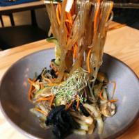 Stir Fry Glass Noodle (Japchae) · Stir fry glass noodle cooked with soy sauce, zucchini, carrot, onion and mushroom.