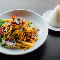 SP1. Crispy Catfish Salad · Shredded catfish meat, battered and deep-fried topped with mango salad, red onions, cashew n...