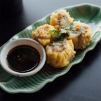 A2. Steamed Dumpling · Chicken-shrimp stuffed dumpling with soy vinaigrette dipping sauce.