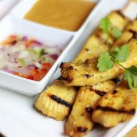 A5. Grilled Chicken Satay · Served with peanut sauce and cucumber relish.