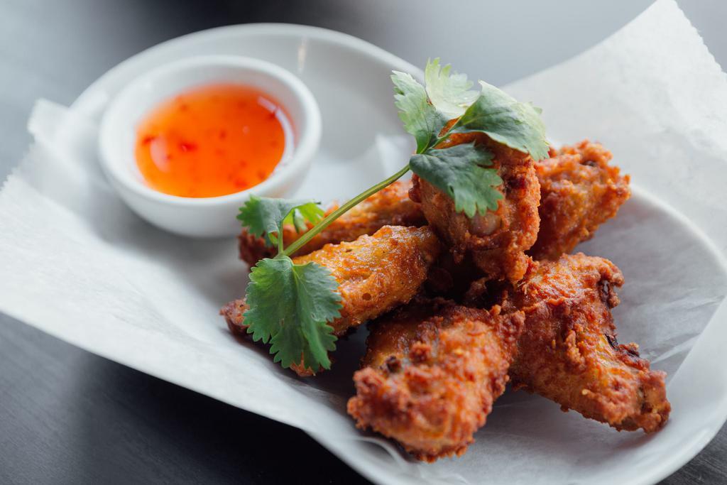 A9. Wings · Fried chicken wings with sweet chili sauce.