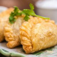 A14. Curry Puff · Ground chicken, potatoes, onions, curry powder with cucumber sauce.