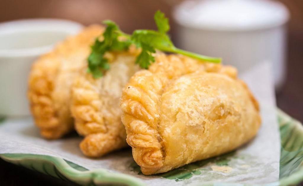 A14. Curry Puff · Ground chicken, potatoes, onions, curry powder with cucumber sauce.