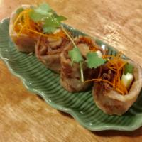 A15. Duck Rolls · Duck, cucumber, scallion, carrot and sauce in wrapped roti.