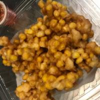 A20. Corn Fritters (v) · Fried sweet corn served with sweet chili sauce. Vegan.