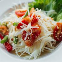 Y1. Som Tum Thai Salad · Papaya salad with tomatoes, long bean, roasted peanuts and dry shrimp. Spicy.