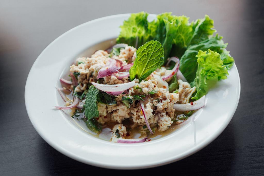 Y8. Larb Salad · Ground meat, red onion, mint, scallions, cilantro, ground toasted jasmine rice ans chili lime dressing. Spicy.