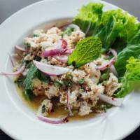Y9. Larb Tofu Salad · Steamed tofu, red onions, mint, scallions, cilantro, ground toasted jasmine rice, and chill ...