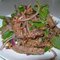 Y10. Namtok Salad · Sliced meat salad, red onion, mint, scallion, cilantro, ground
toasted jasmine rice, chili l...