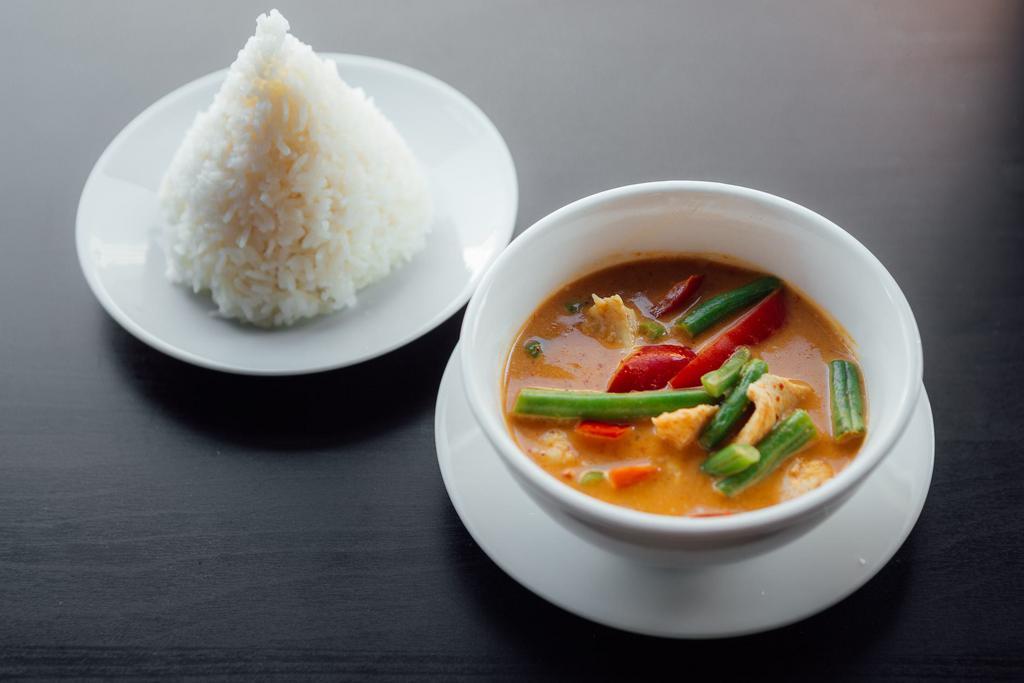 C1. Red Curry · Coconut curry, eggplant, string beans, bell peppers, bamboo shoots, and basil leaves. Served with jasmine rice.  Spicy.