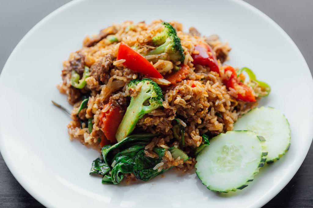 F2. Spicy Basil Fried Rice · Onions, basil leaves, bell peppers, broccoli, long hot peppers, carrots, and egg. Spicy.