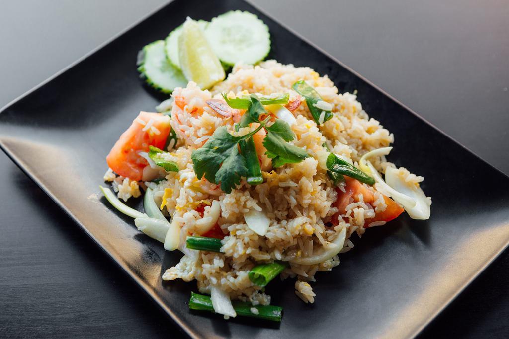 F5. Crab Fried Rice · Onion, scallions, tomatoes, and egg.