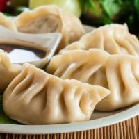 8 Piece Pork and Napa Cabbage Dumplings · Stuffed dough. Pan fried or steamed.