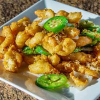 Salt and Pepper Chicken · Crispy white meat chicken tossed with bell peppers, onions and jalapenos. Served with your c...