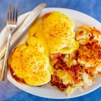 *Eggs Benedict* · split toasted english muffin, ham, poached eggs ＆ hollandaise sauce with hash browns