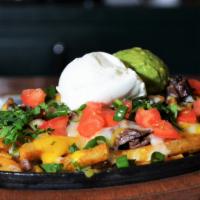 Carne Asada Fries · French fries, carne asada steak, and melted cheese. Served with guacamole, pico de gallo and...