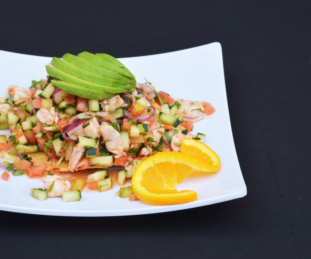 Ceviche de Camaron · Shrimp marinaded in lime juice. Served with cilantro, jitomate, onions and cucumber.