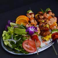 brocheta de Camarones · #3 Shrimp skewers, served with rice and salad.