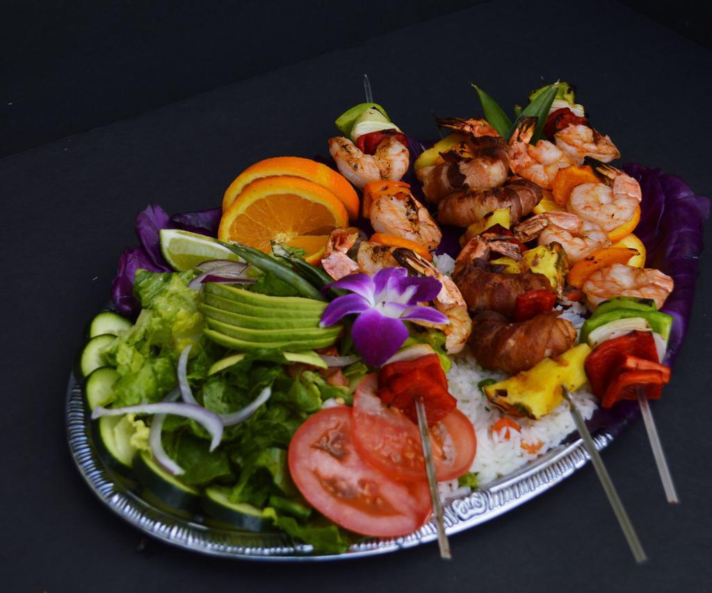 brocheta de Camarones · #3 Shrimp skewers, served with rice and salad.