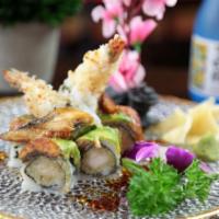 Dancing Eel Roll · Inside: shrimp tempura and cucumber. Outside: eel and avocado with eel sauce.