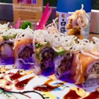 Spider-Man Roll · Inside: soft shell crab & cream cheese                    Top: sliced smoked salmon,avocado ...