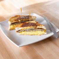 Breakfast Sandwich · 2 scrambled eggs, choice of cheese, meat or roasted vegetables, and choice of bread.

