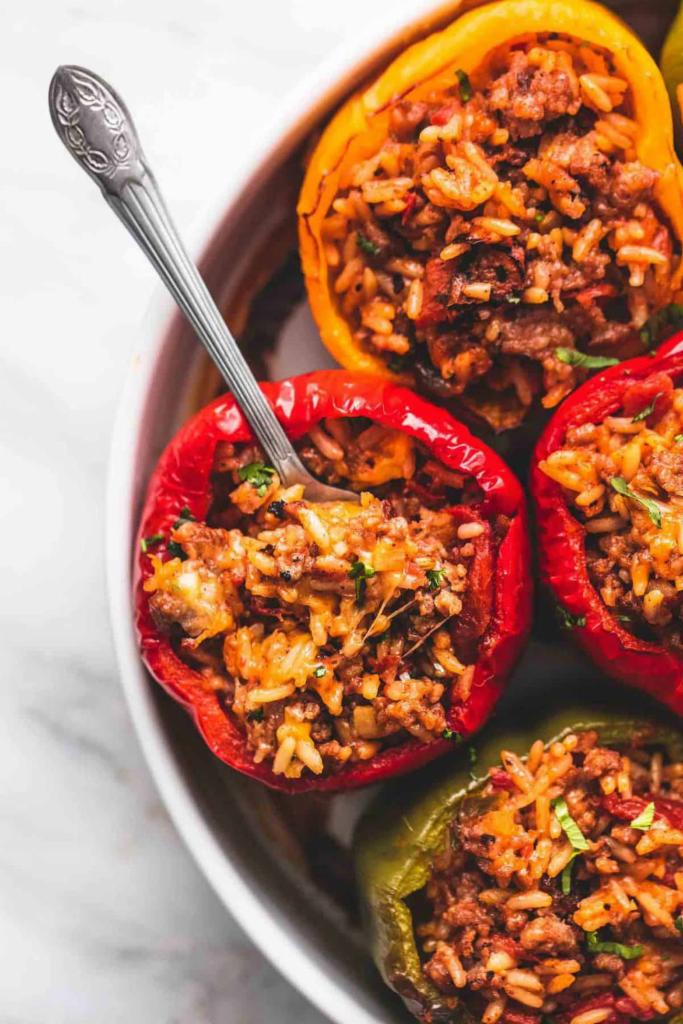 Stuffed Bell pepper · Bell peppers, stuffed with rice, roasted vegetables, such as eggplants, mushrooms, onion, garlic, tomatoes, salad, rice and pita bread