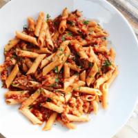 Penne Pasta Primavera with Bolognese Sauce · Locally grown carrots, celery, garlic, and tomatoes.