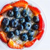 Chia Pudding Parfait · Chia pudding prepared with almond milk topped with fresh berries and your choice of honey or...