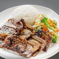 Short Ribs (Kalbi) · Marinated beef short ribs grilled over fire. Gluten free.