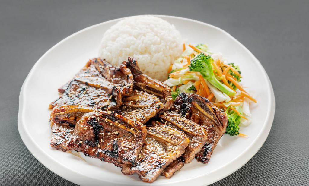 Short Ribs (Kalbi) · Marinated beef short ribs grilled over fire. Gluten free.