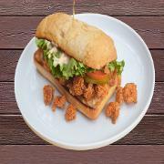 Over-Stuffed Shrimp Po-Boy · There's nothing po' about this boy! 1/4 lb. of shrimp stuffed in ciabatta bread with green l...