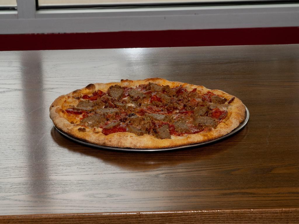 Meat Lovers Pizza · Fresh mozzarella, pepperoni, sausage, Canadian ham, spicy capicola, bacon and sliced meatballs with plum tomato sauce.