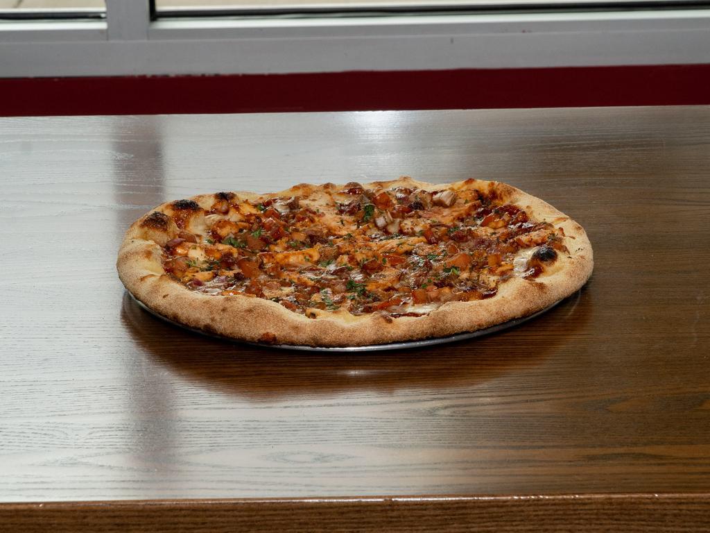 BBQ Chicken Pizza · Fresh mozzarella, chicken, BBQ sauce, bruschetta, bacon and cilantro.