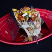 Fish Taco · Grilled mahi mahi, cabbage and chipotle sauce or habanero mango fruit salsa. 
