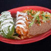 Tamale Plato · 2 freshly made tamales stuffed with chicken smothered in choice of salsa with cheese and sou...