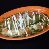Tamale · Choice of sauce, chicken, cheese, sour cream and pico.