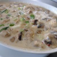 Tom Kha Combination Seafood Soup · Spicy and sour coconut soup.