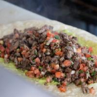 Carne Asada Burrito · Con carne asada, guacamole and pico de gallo.