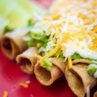 10 Rolled Tacos · Crispy beef rolled tacos with guacamole, sour cream, lettuce, pico de gallo, and cheese.
