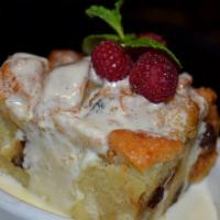 Bread Pudding · Chunky French bread and raisins, mixed with a sweet Grand Marnier cream custard, topped with...