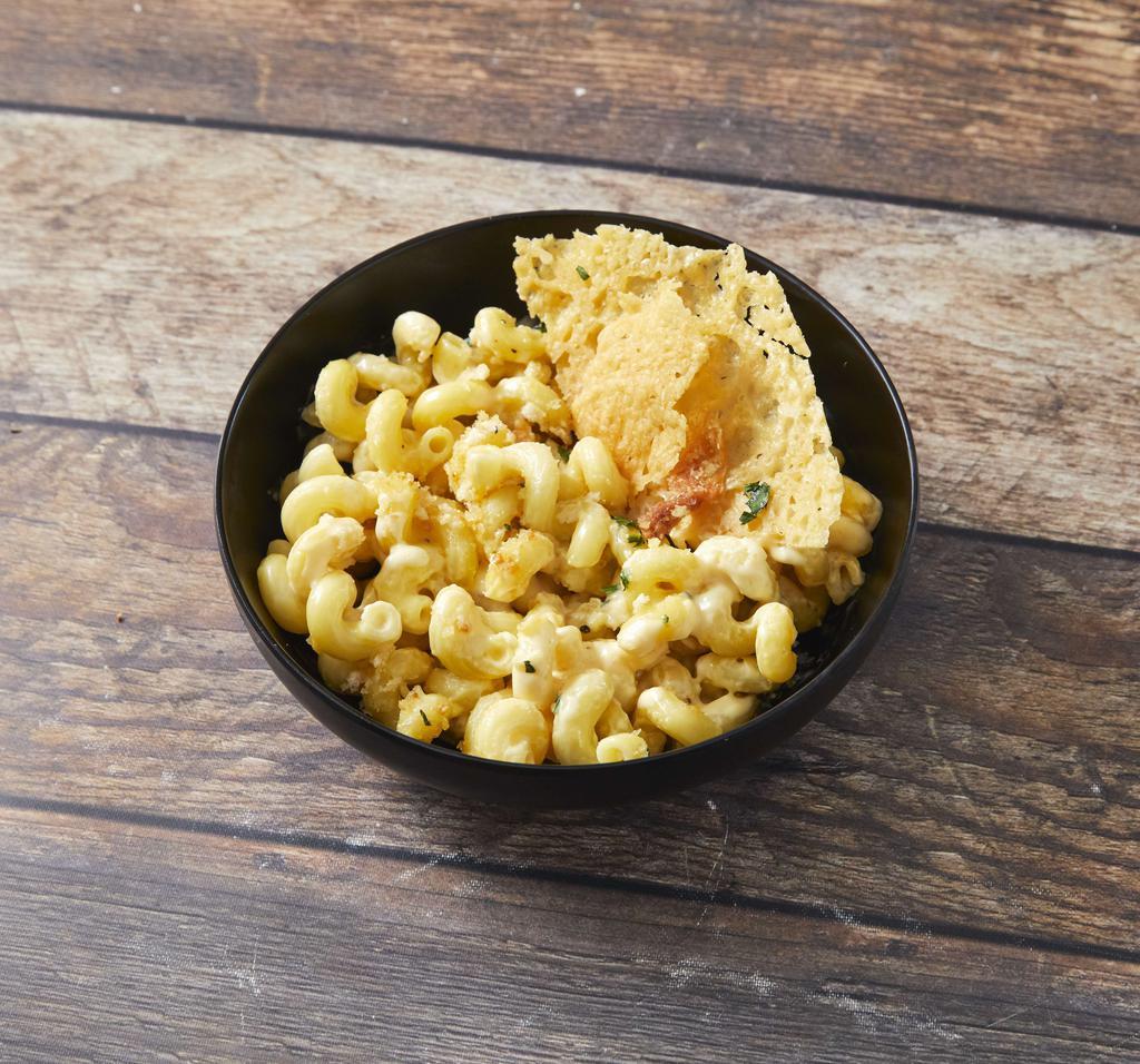 Classic Mac and Cheese · Cavatappi pasta, bold house cheese blend, toasted garlic breadcrumbs, fresh herbs, and Parmesan crisp.